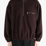 Brown hoodie worn by a person, showing the hoodie 's fit