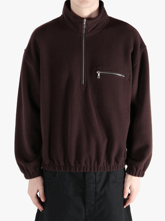 Brown hoodie worn by a person, showing the hoodie 's fit