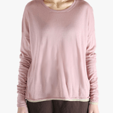 Pink top worn by a person, showing the top fit
