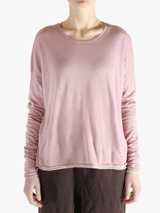 Pink top worn by a person, showing the top fit