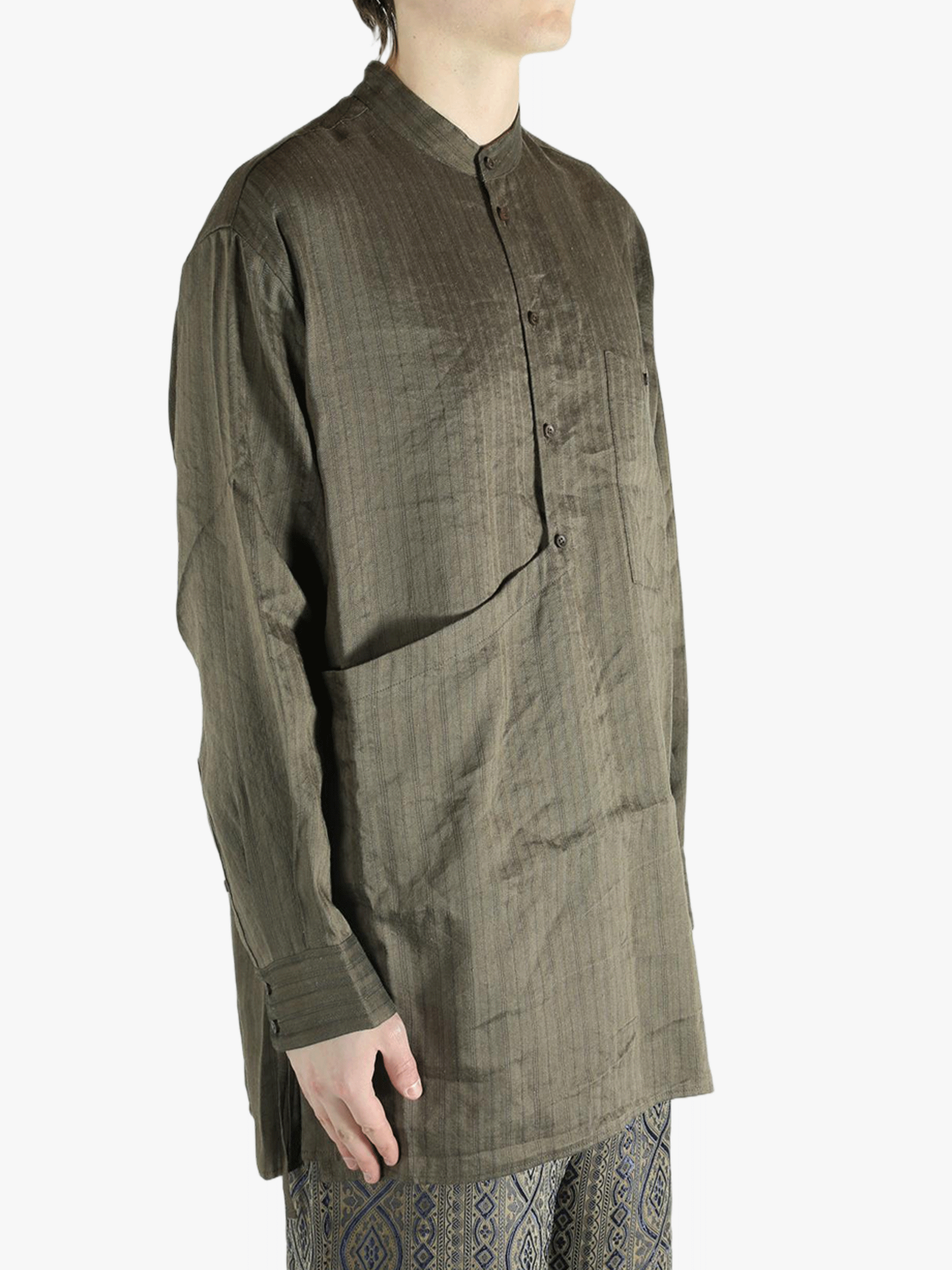 Grey top worn by a person, showing the top's fit