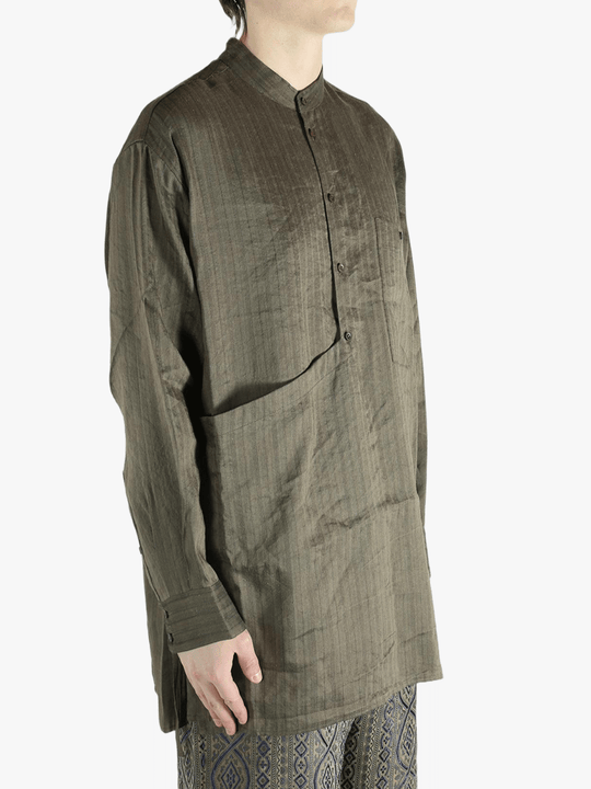 Grey top worn by a person, showing the top's fit