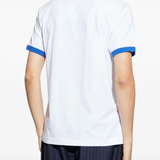 White t-shirt worn by a person, showing the shirt's fit