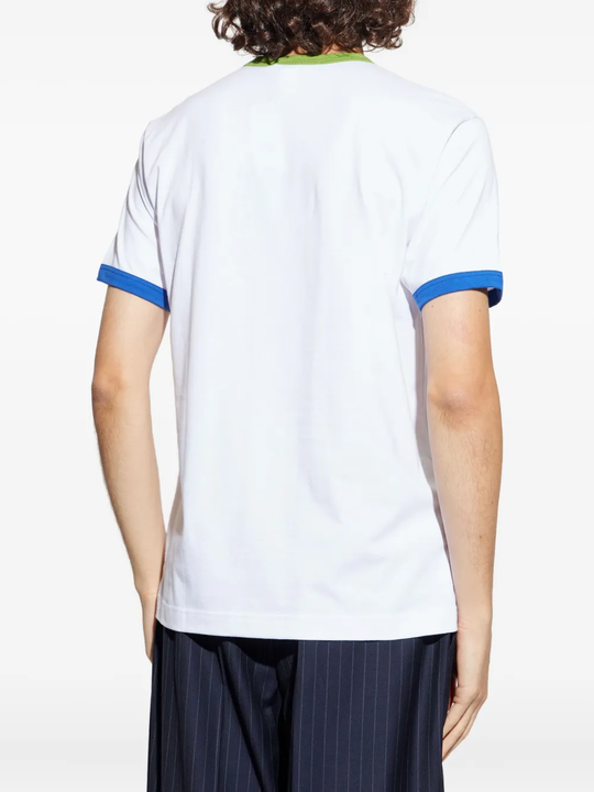 White t-shirt worn by a person, showing the shirt's fit