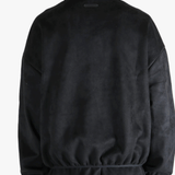 Black jacket worn by a person, showing the jacket's fit