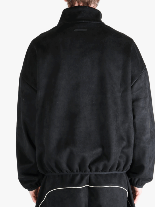 Black jacket worn by a person, showing the jacket's fit
