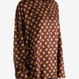 Brown shirt worn by a person, showing the shirt's fit