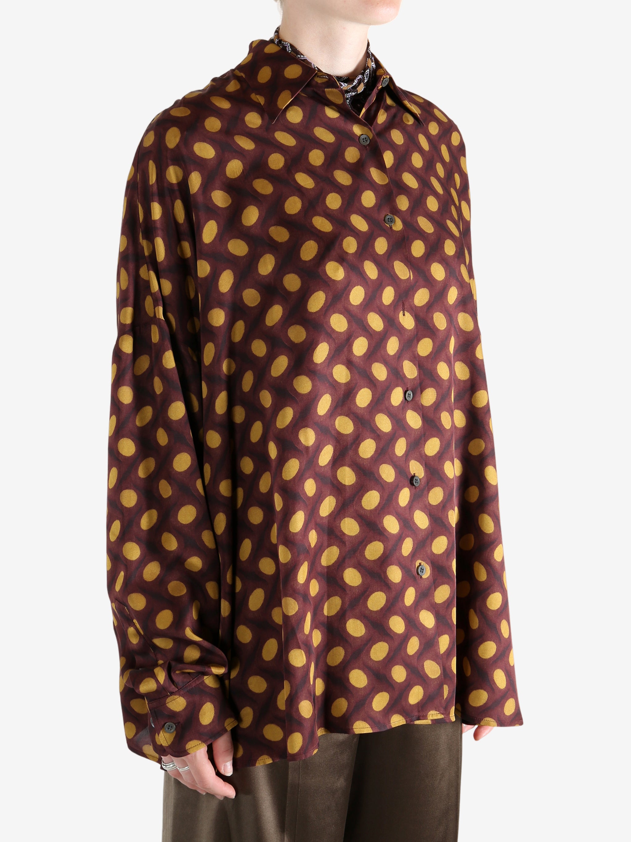 Brown shirt worn by a person, showing the shirt's fit