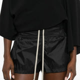 Close up of black shorts, showing texture of the polyamide fabric