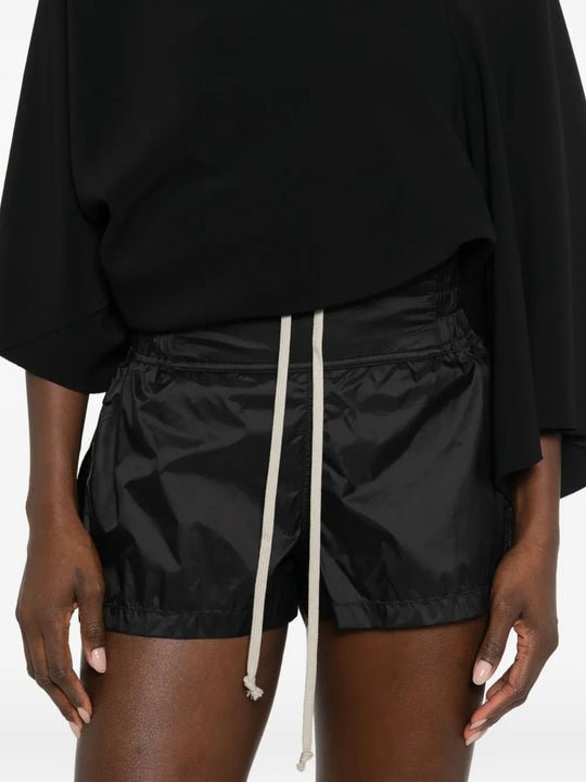 Close up of black shorts, showing texture of the polyamide fabric