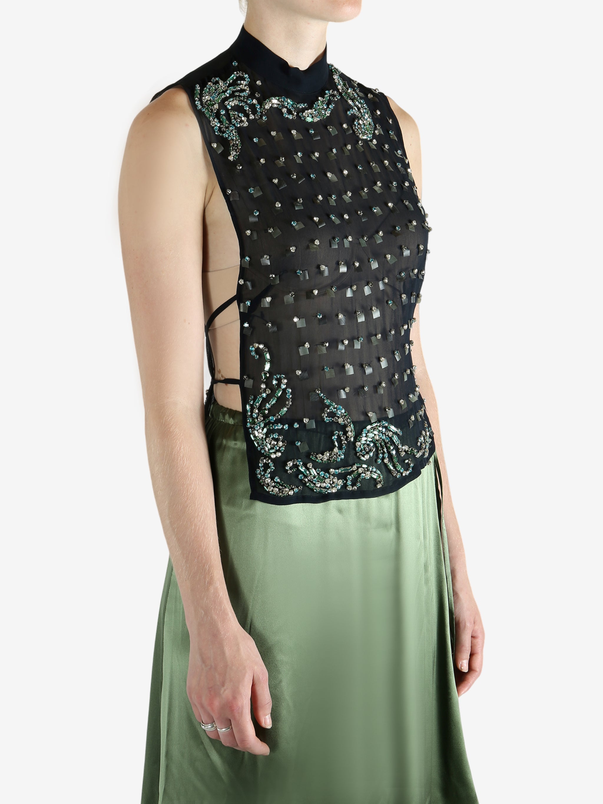 Green top worn by a person, showing the top fit