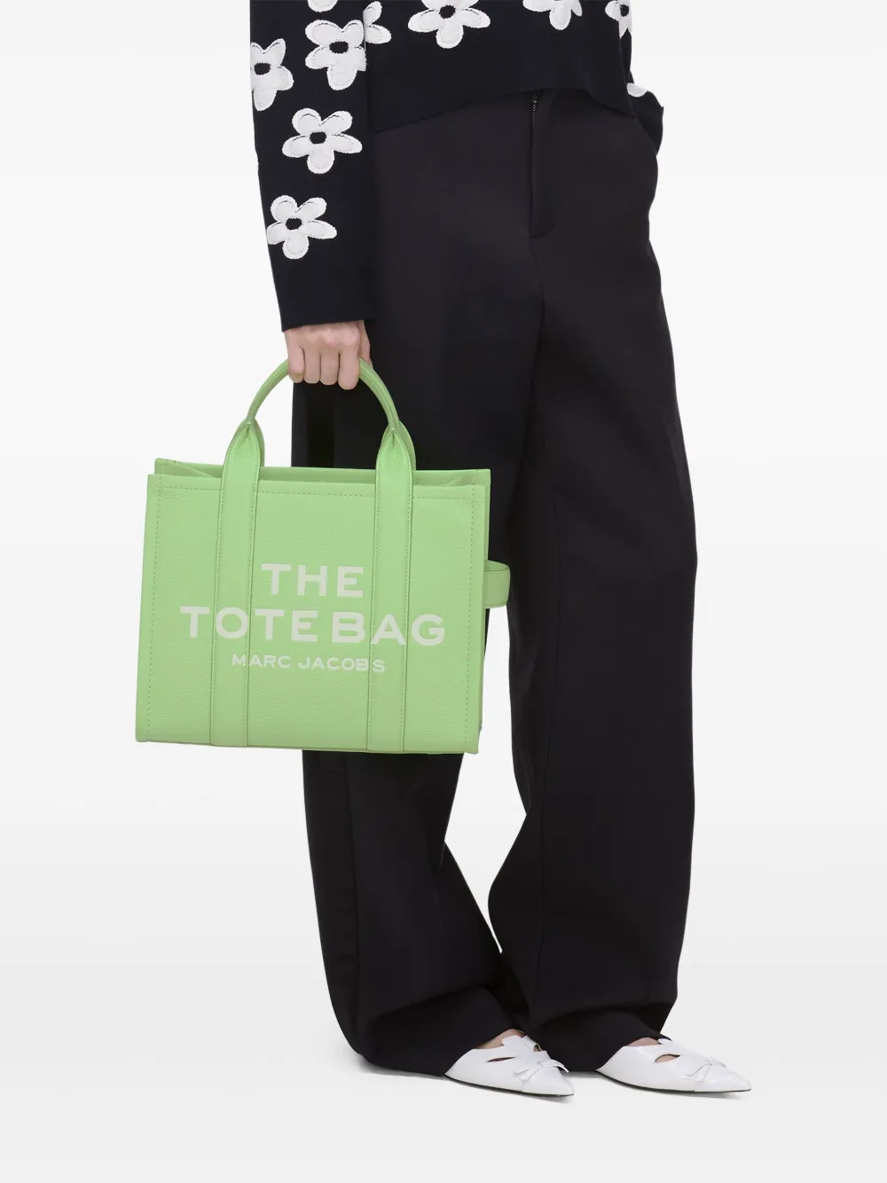 Green bags worn by a person, showing the bags fit