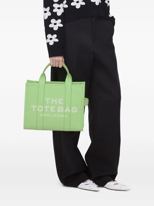 Green bags worn by a person, showing the bags fit