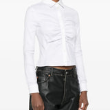 White shirt worn by a person, showing the shirt's fit