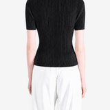 Black shirt worn by a person, showing the shirt fit