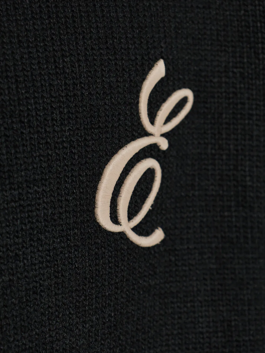 Close up of black sweater, showing texture of the Acrylic fabric