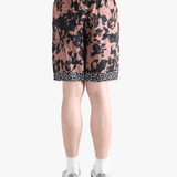 Pink shorts worn by a person, showing the shorts fit 