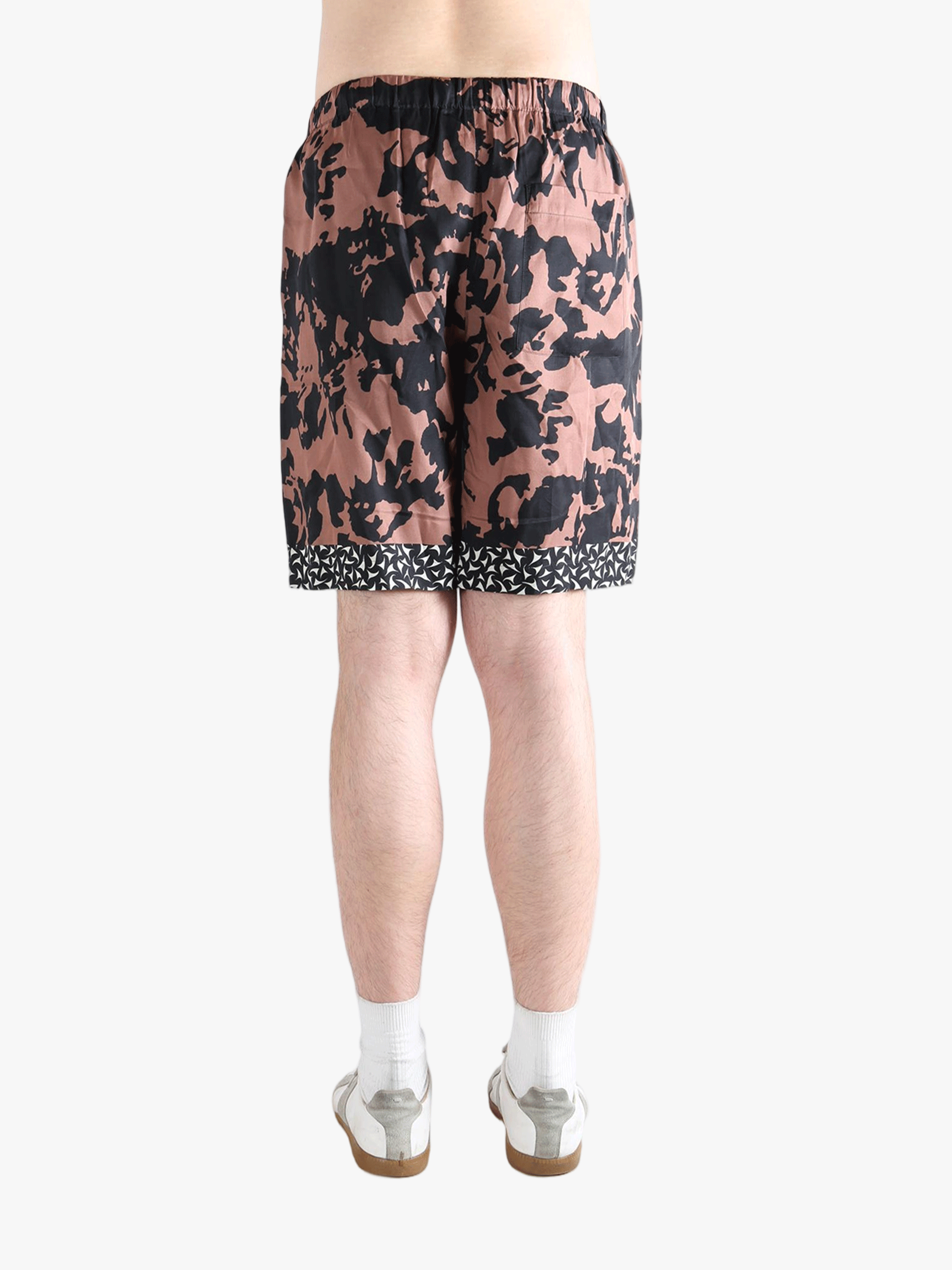 Pink shorts worn by a person, showing the shorts fit 