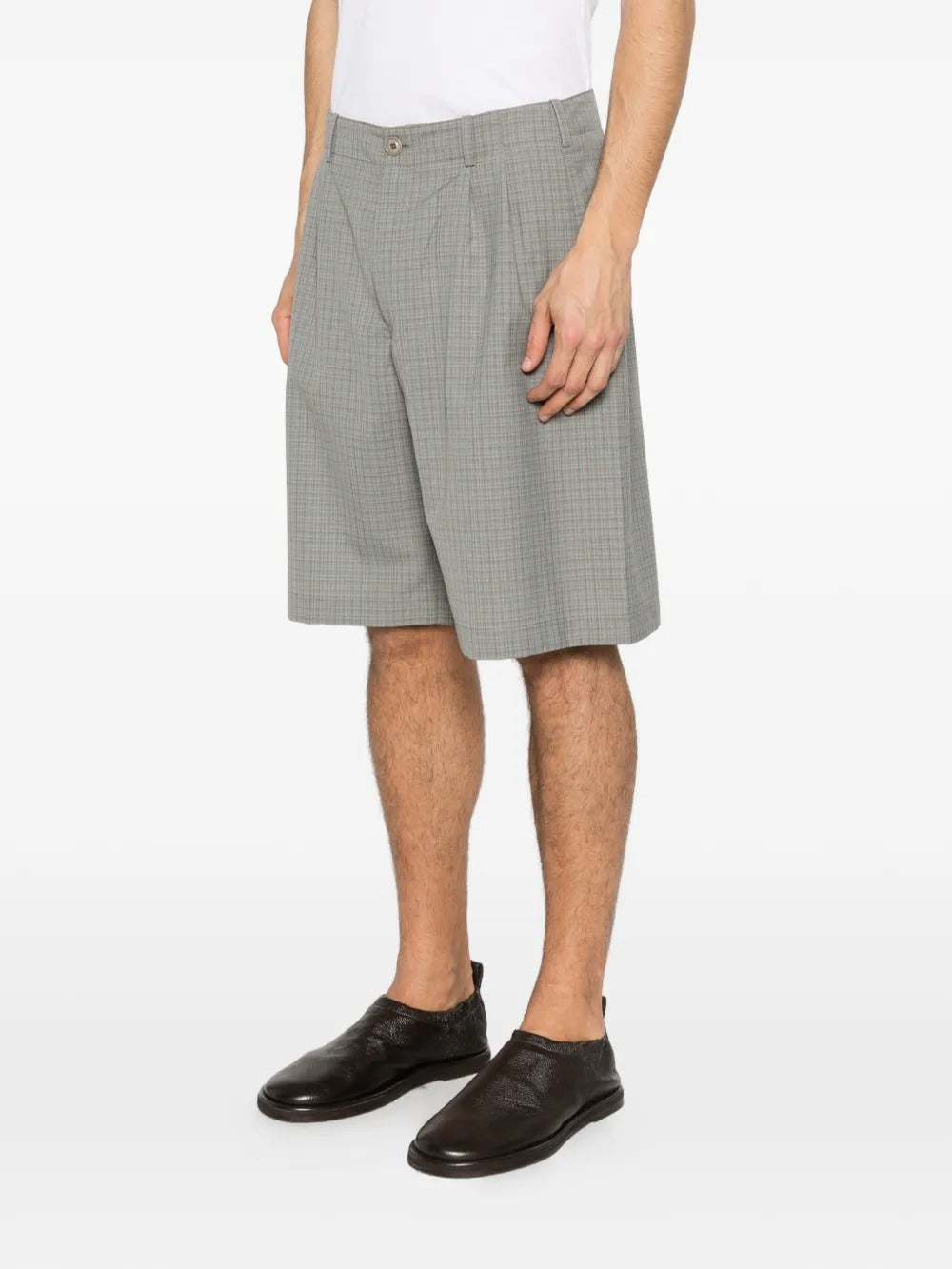 Green shorts worn by a person, showing the short's fit