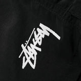 Close up of black short, showing texture of the fabric