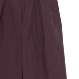 close up of brown pants, showing texture of the wool fabric