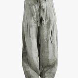 Gray wide-leg pants worn by a person, showing the pants fit