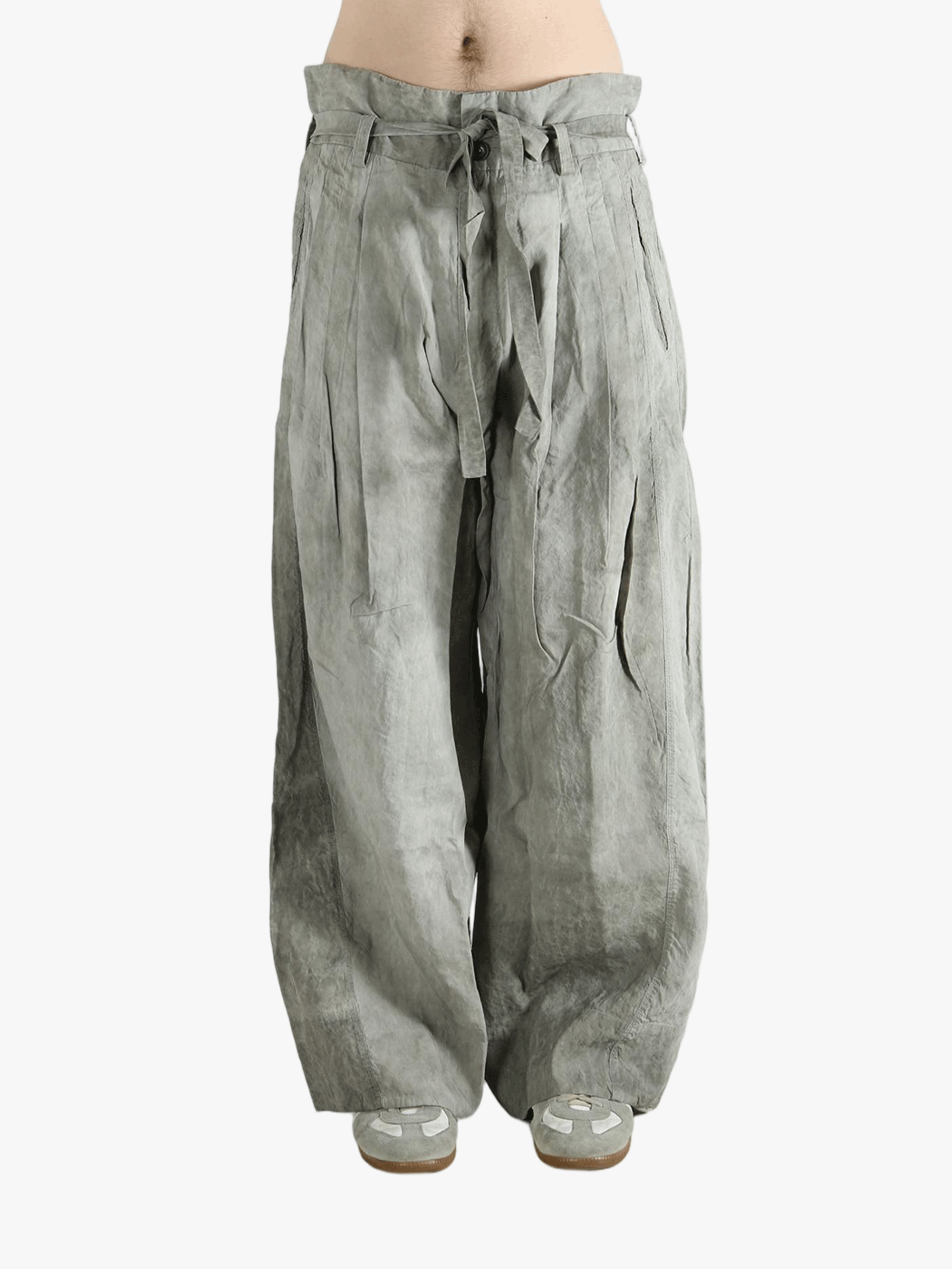 Gray wide-leg pants worn by a person, showing the pants fit