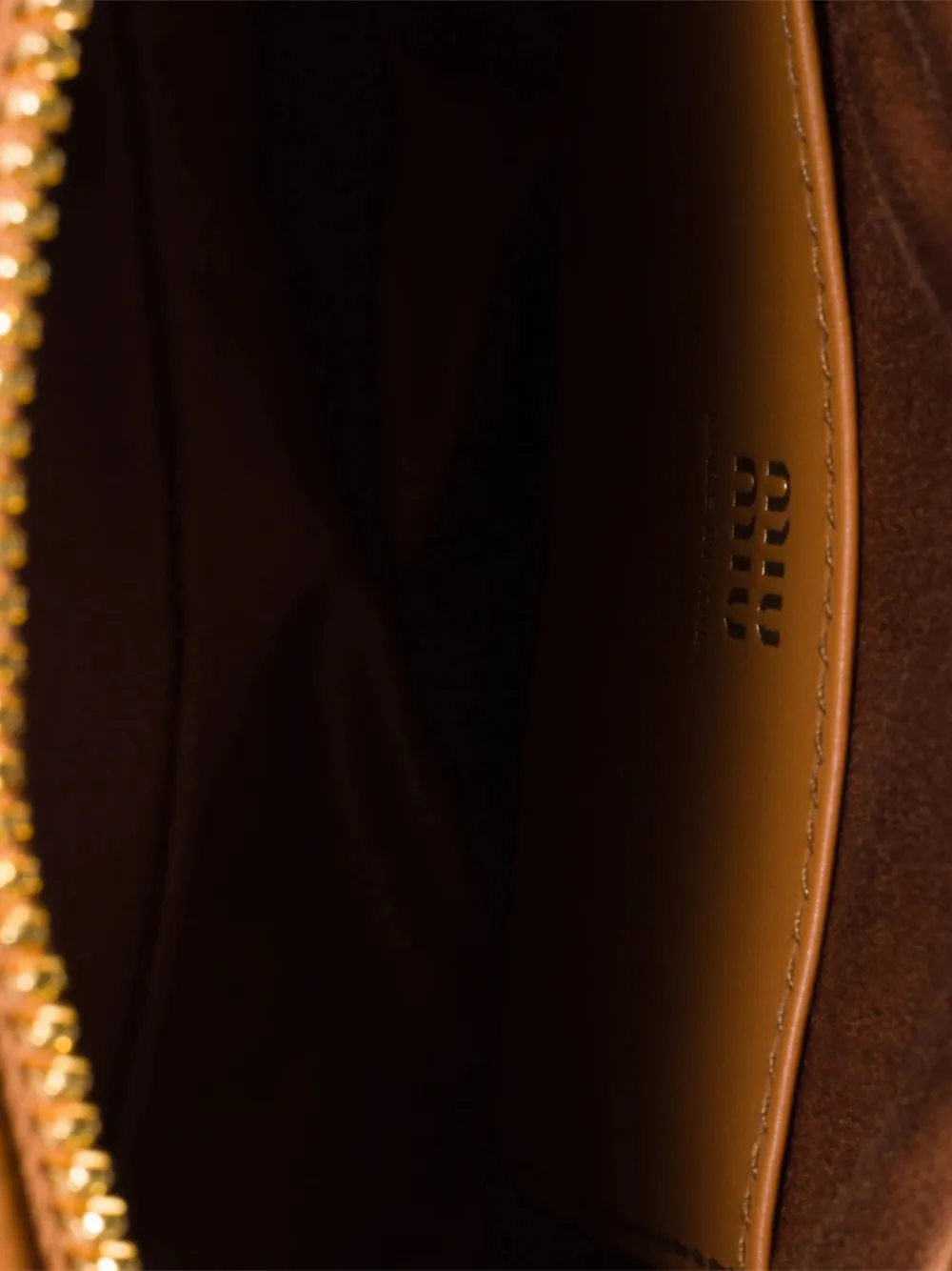 close up of brown bags ,showing texture of the calfskin fabric