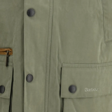 Close up of green jacket, showing texture of the cotton fabric