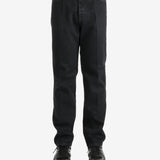 Black pants worn by a person, showing the pants's fit