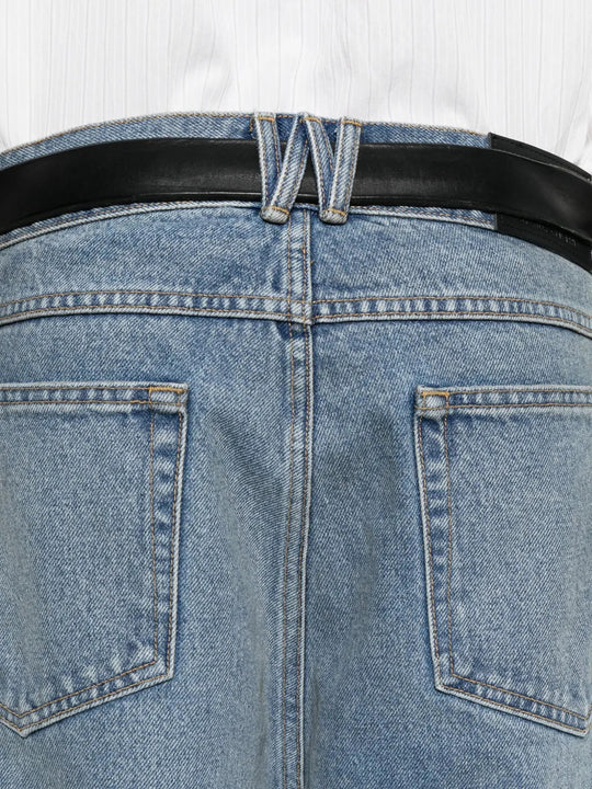 Blue pants worn by a person, showing the pants fit