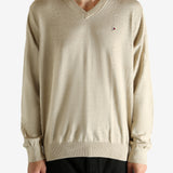 Tan shirt worn by a person, showing the shirt's fit