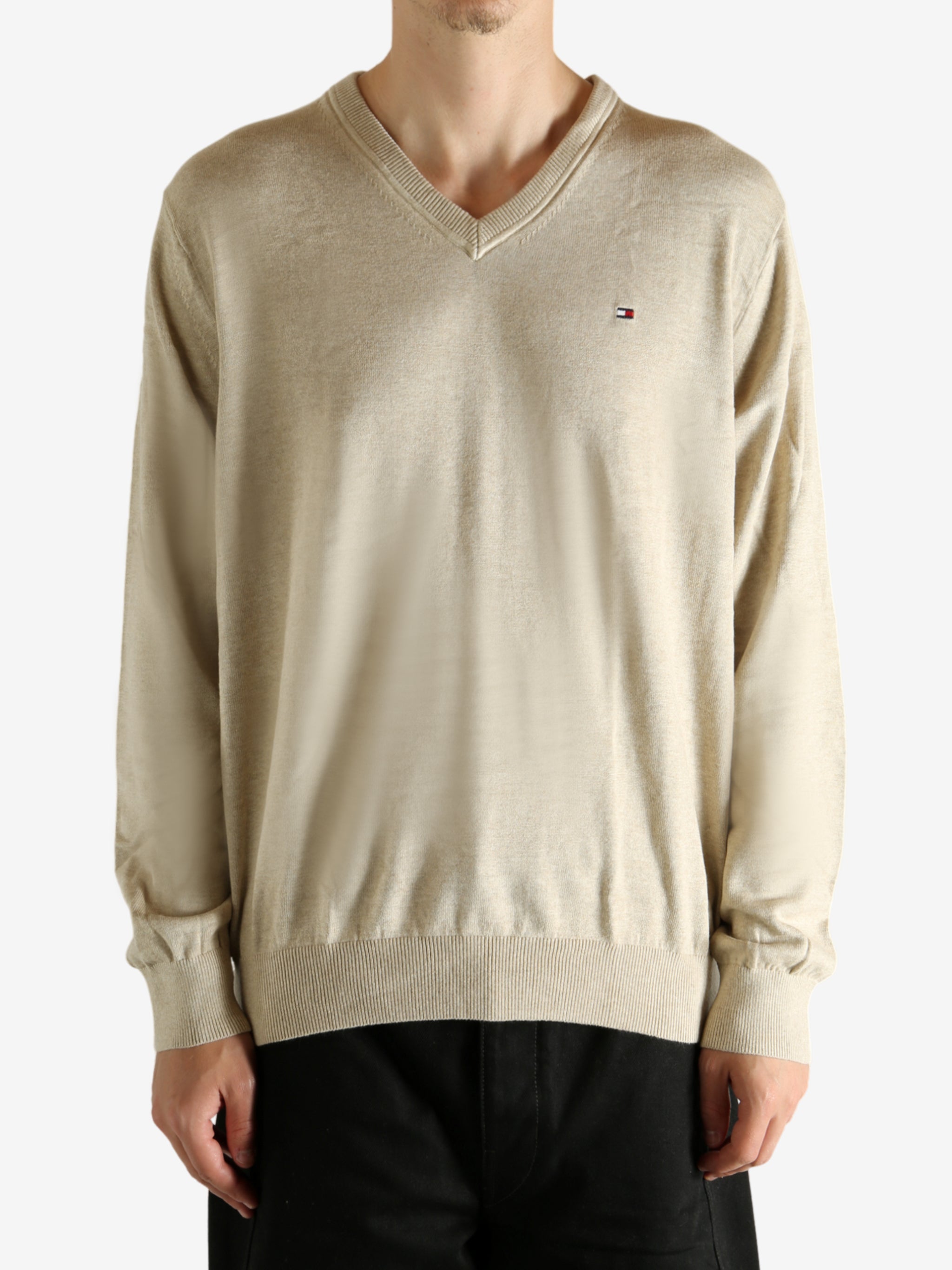 Tan shirt worn by a person, showing the shirt's fit