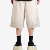 Tan shorts worn by a person, showing the shorts fit