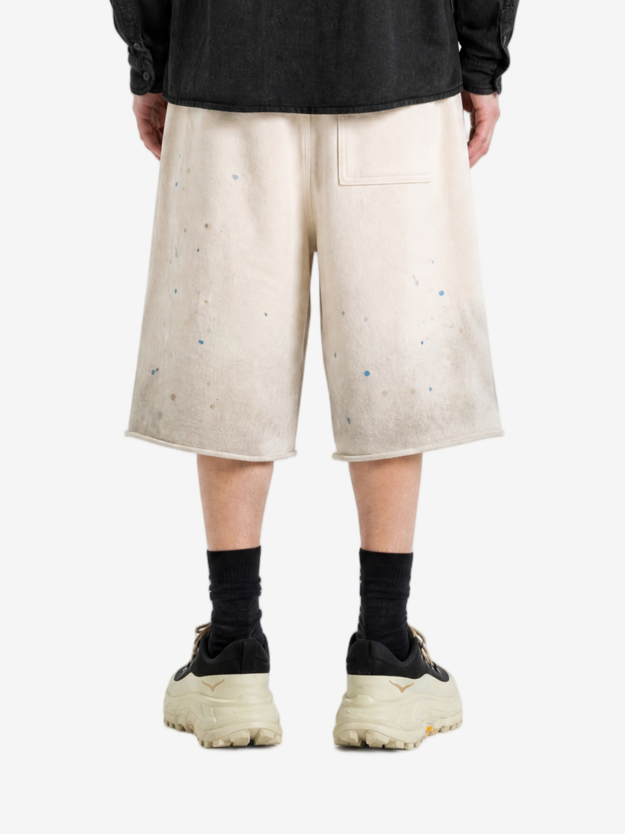 Tan shorts worn by a person, showing the shorts fit