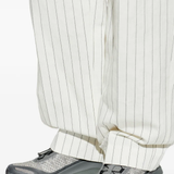 Grey sneakers, full body view