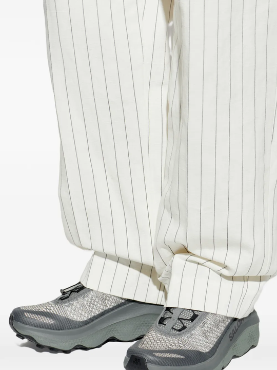 Grey sneakers, full body view
