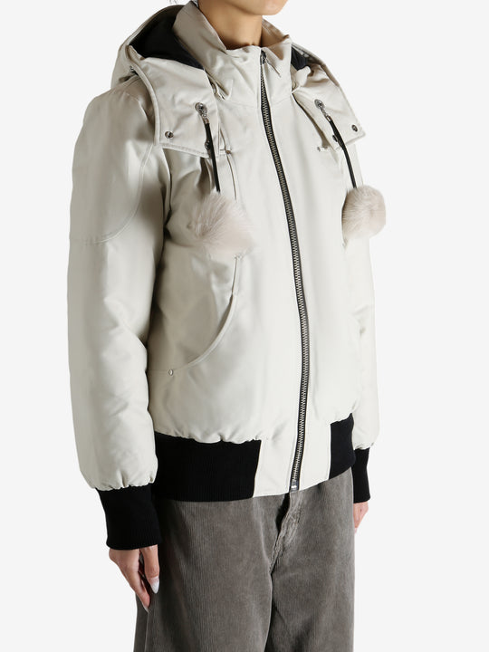 White bomber worn by a person, showing the bomber fit