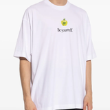 White t-shirt worn by a person, showing the shirt's fit