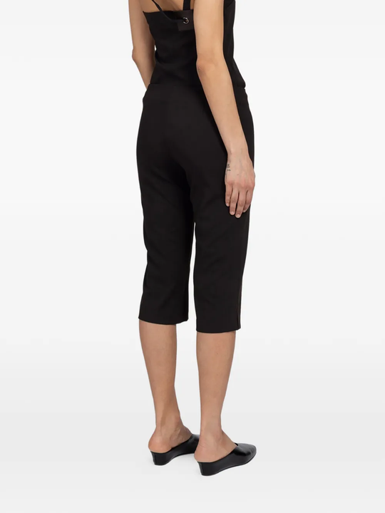 Brown pants worn by a person, showing the pants' fit