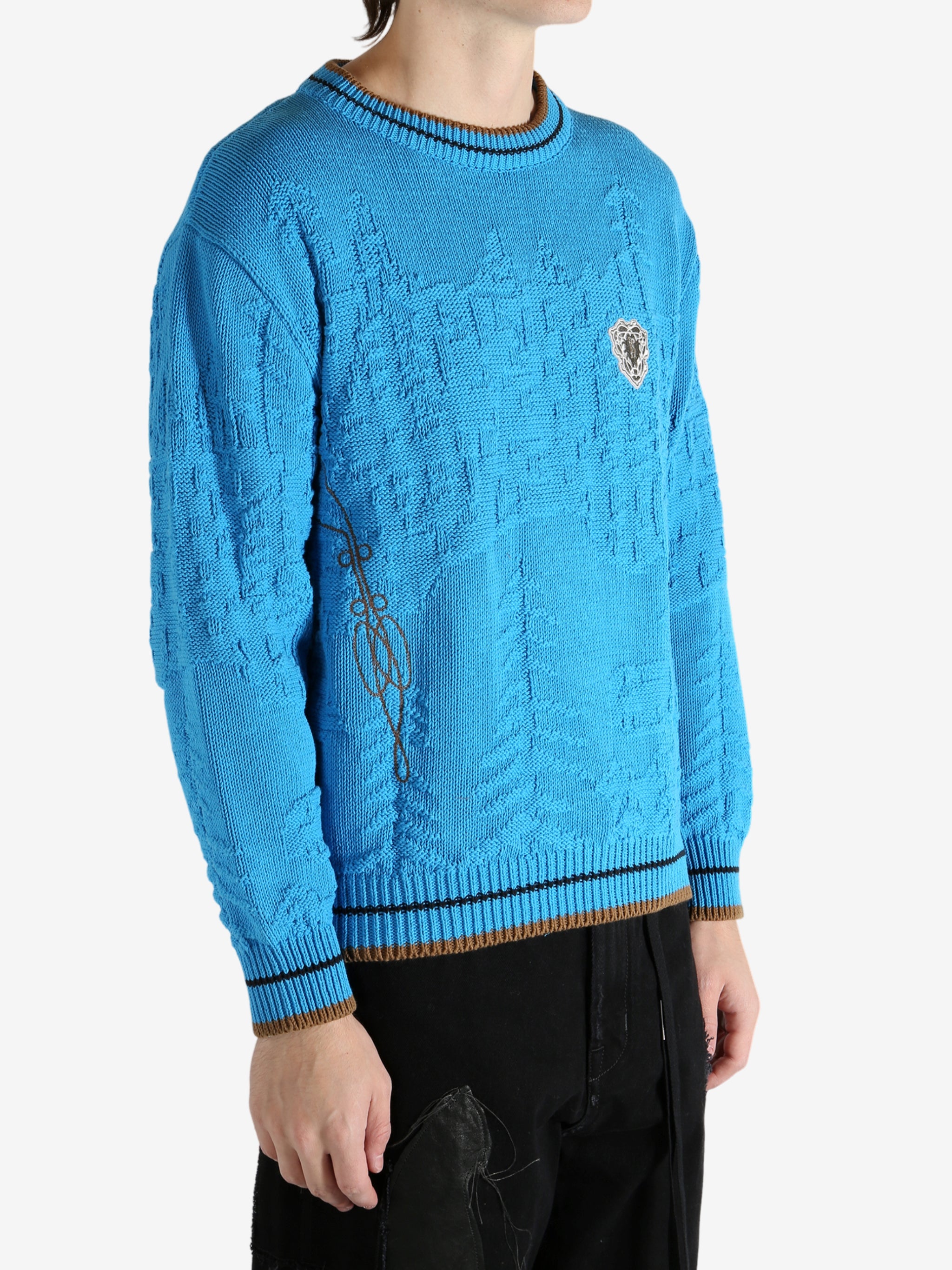 Blue jumper worn by a person, showing the jumper's fit