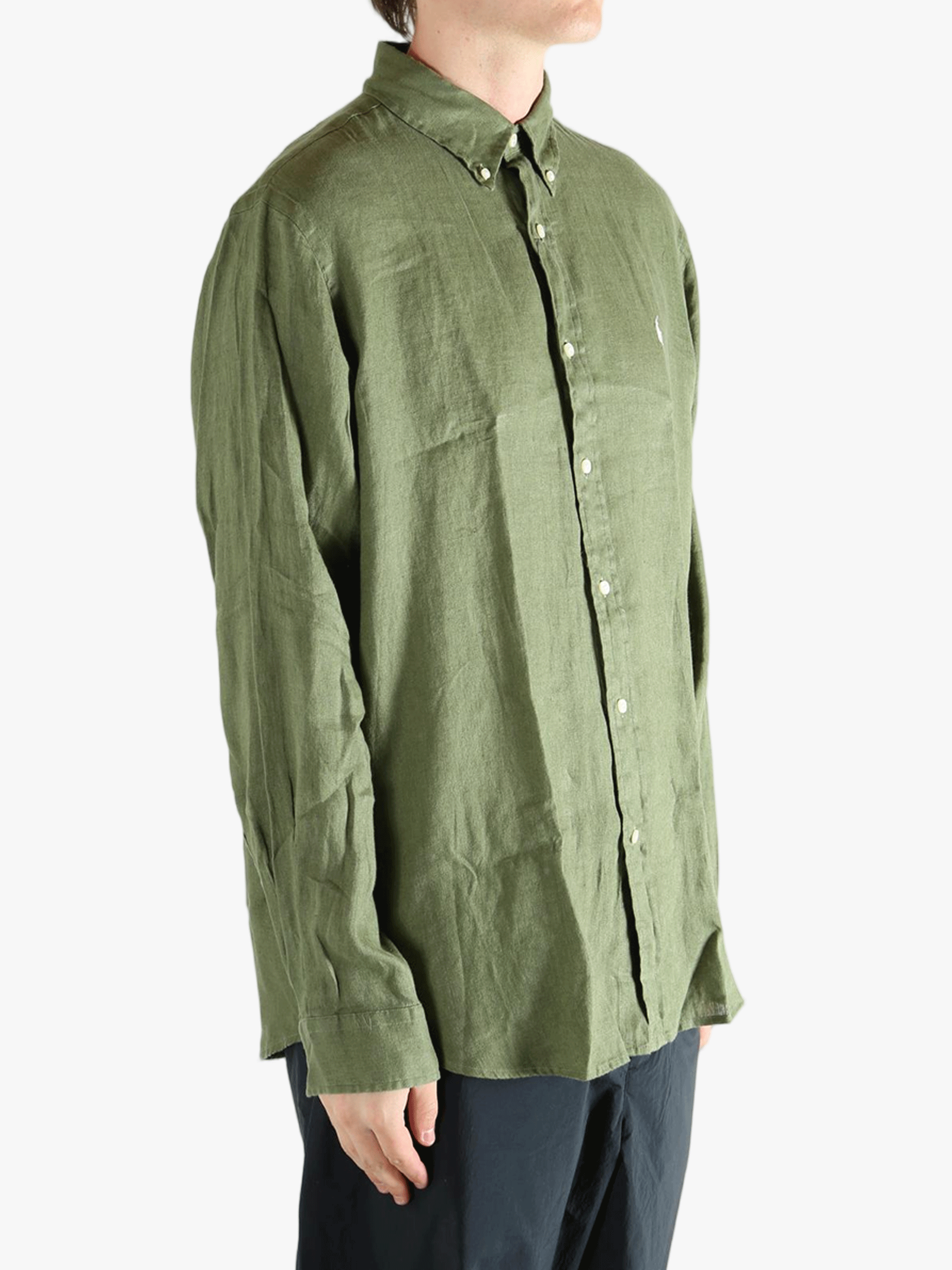 Green shirt worn by a person, showing the shirt's fit