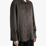 Brown shirt worn by a person, showing the shirt fit