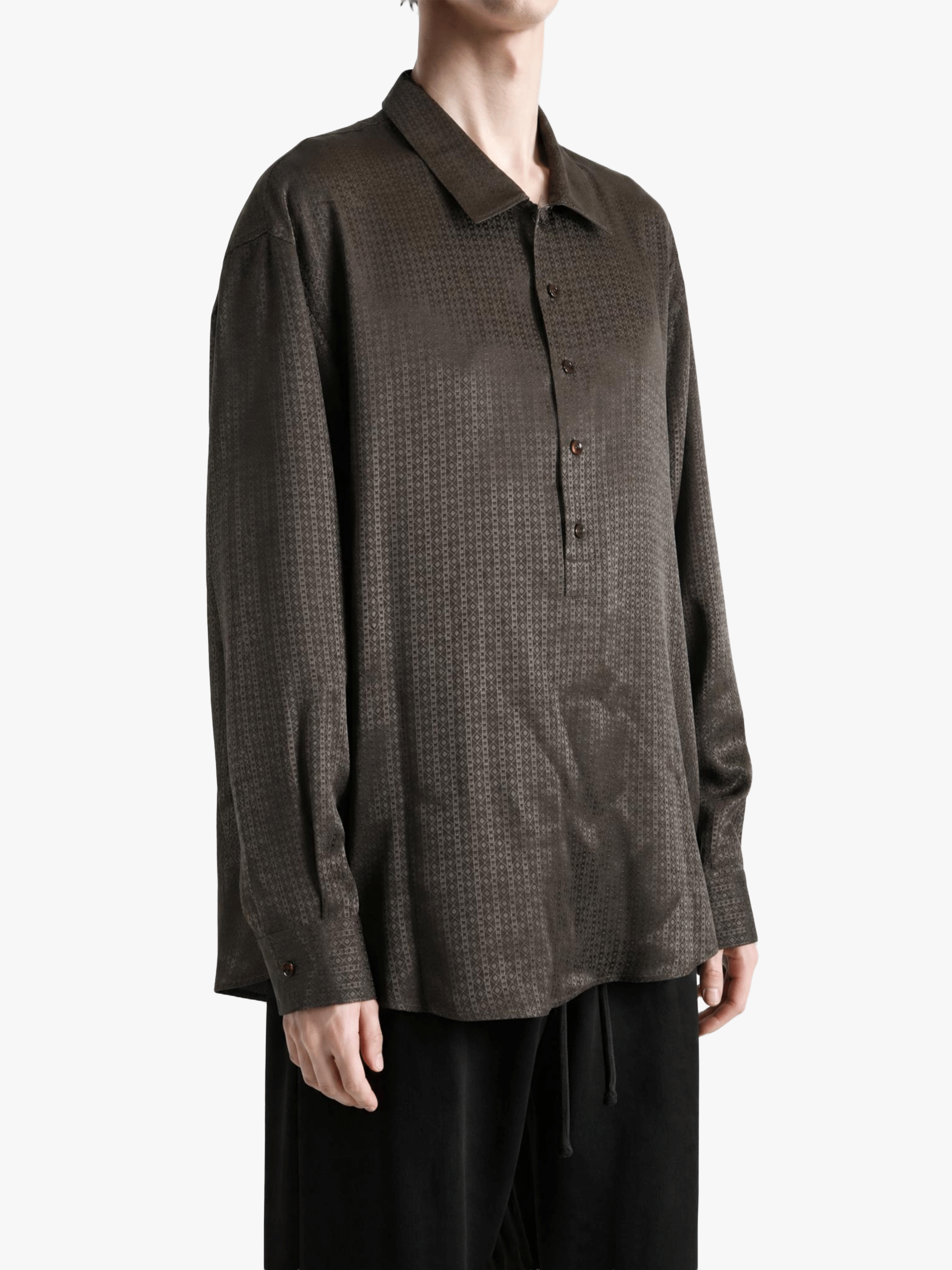 Brown shirt worn by a person, showing the shirt fit