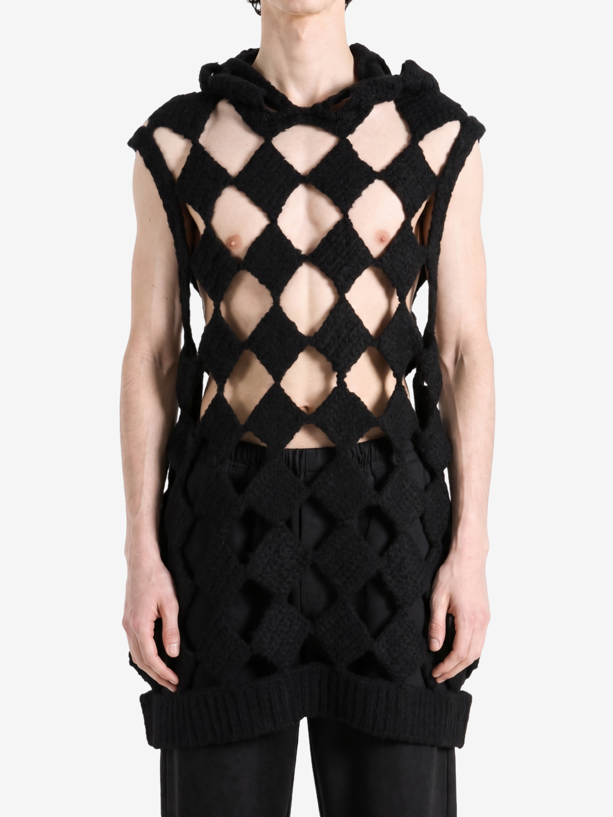 Black top worn by a person, showing the top fit