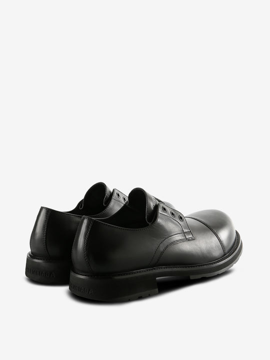 Black derbys, back view