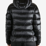 Black jackets-coats worn by a person, showing the jackets-coats fit