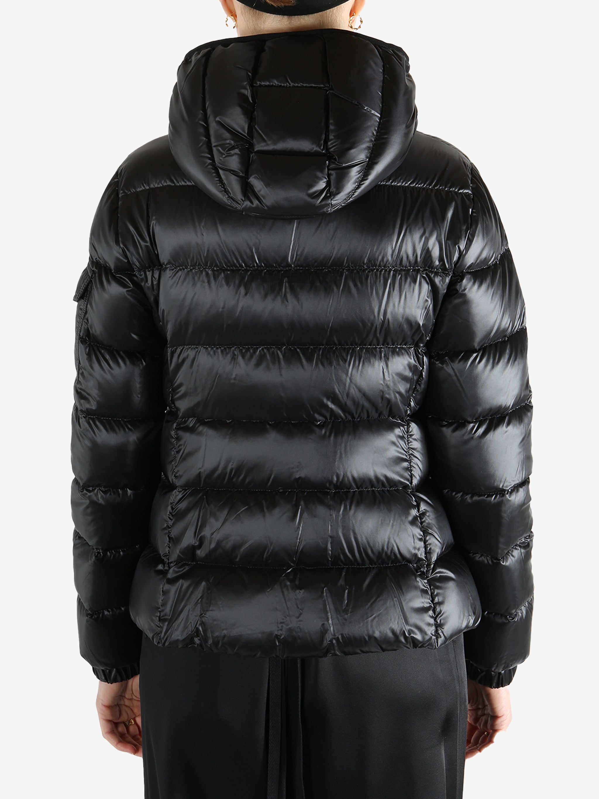 Black jackets-coats worn by a person, showing the jackets-coats fit