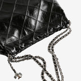 Close up of black bag, showing texture of the leather fabric