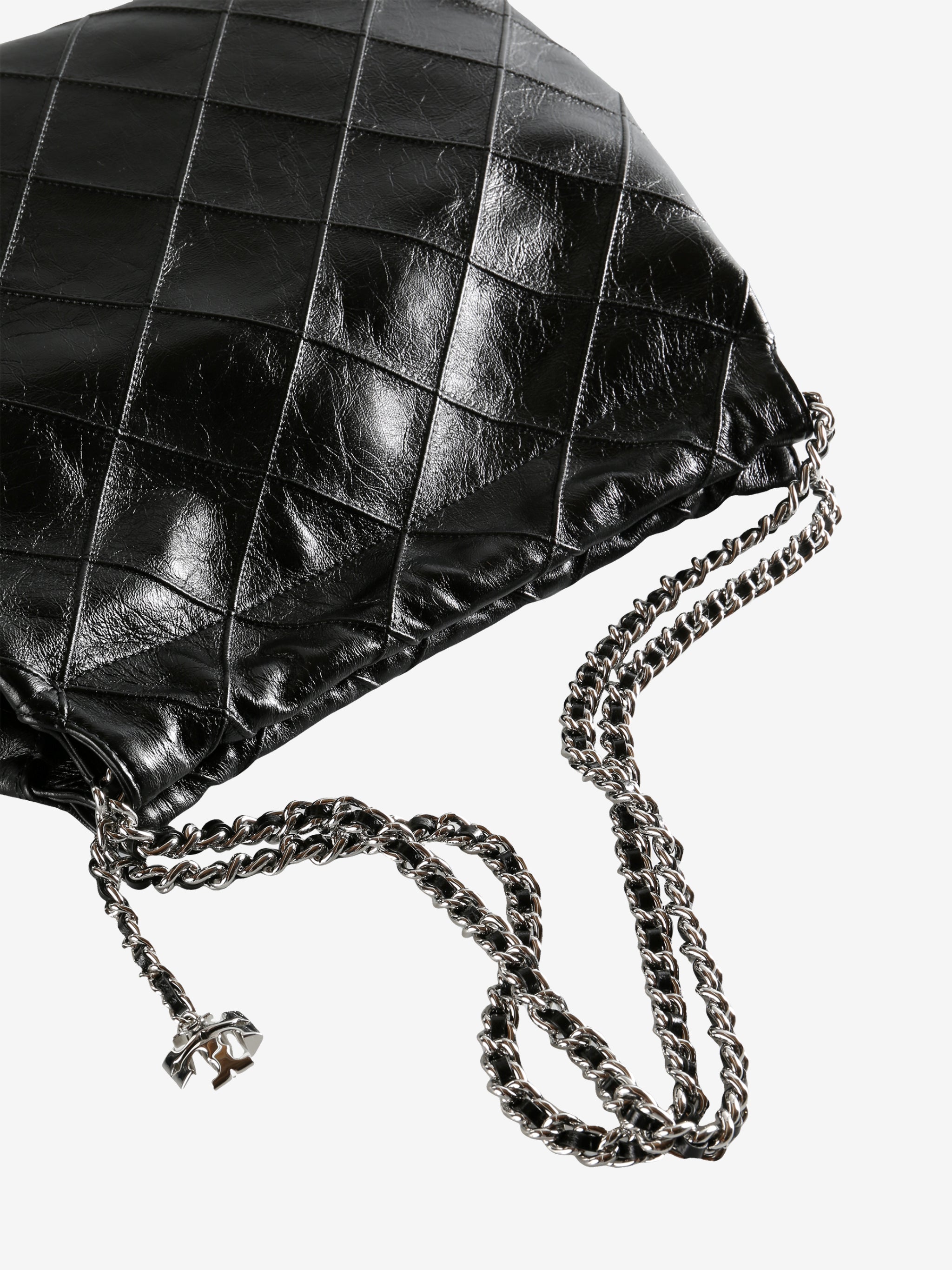 Close up of black bag, showing texture of the leather fabric